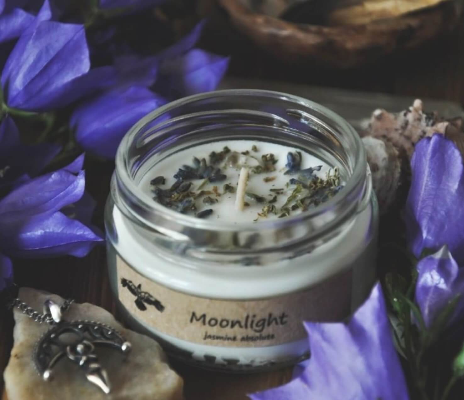 Eco candle with herbs in a glass jar